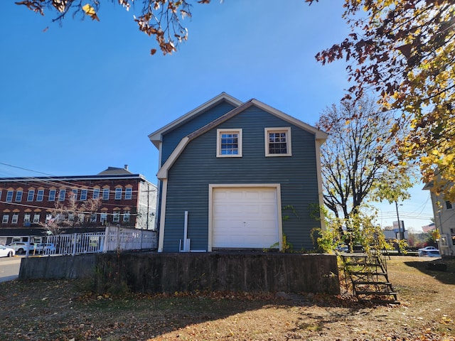 view of side of home with a garage