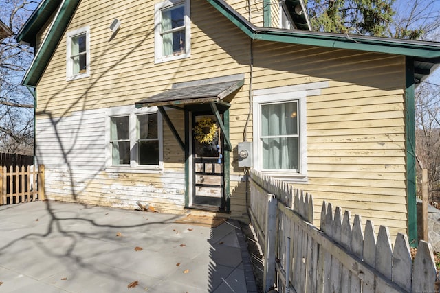 view of property exterior with a patio