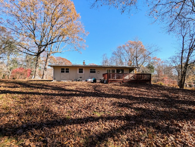 back of property featuring a deck