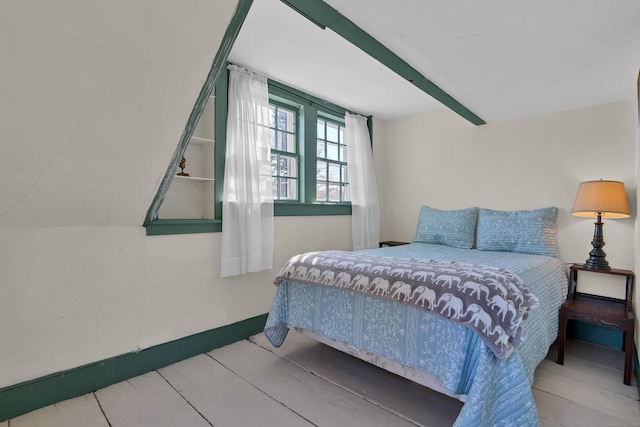 bedroom with hardwood / wood-style floors