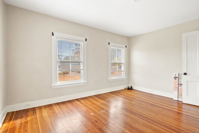 spare room featuring hardwood / wood-style flooring