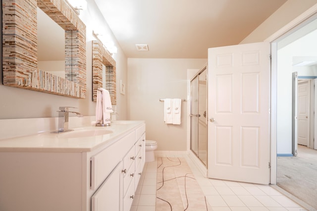 full bath featuring double vanity, a stall shower, a sink, tile patterned floors, and toilet