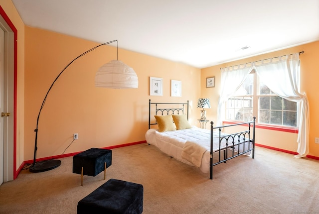 bedroom with baseboards and carpet floors