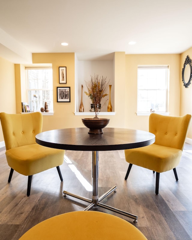 dining area with recessed lighting and wood finished floors