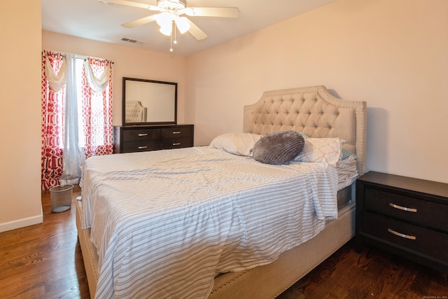 bedroom with dark wood-type flooring and ceiling fan