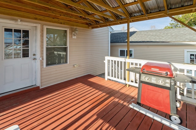 wooden terrace with a grill