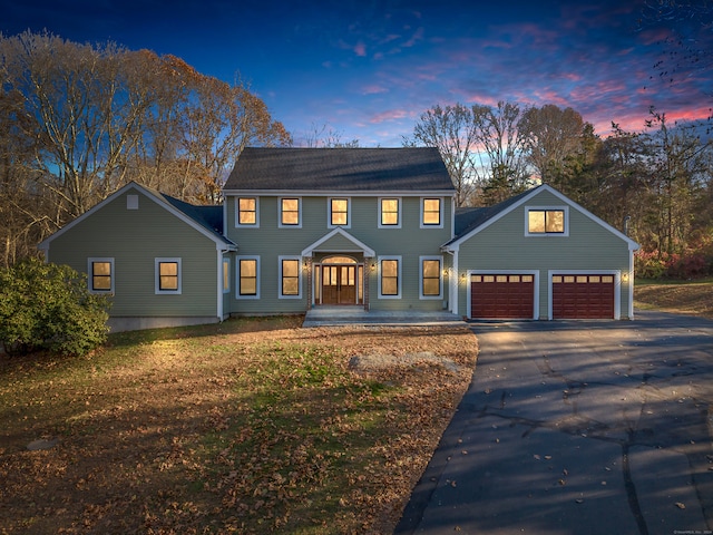 colonial house featuring a garage