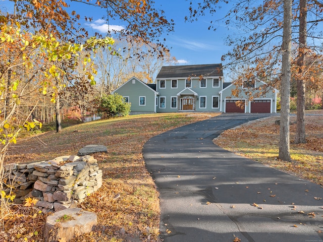 colonial-style house featuring a garage