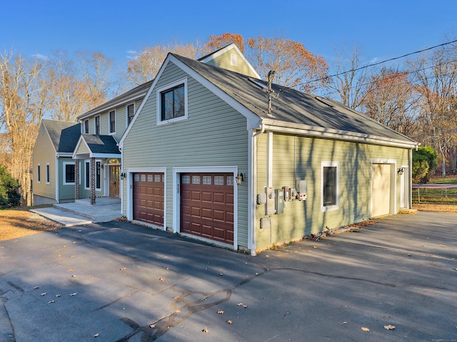 view of property exterior with a garage