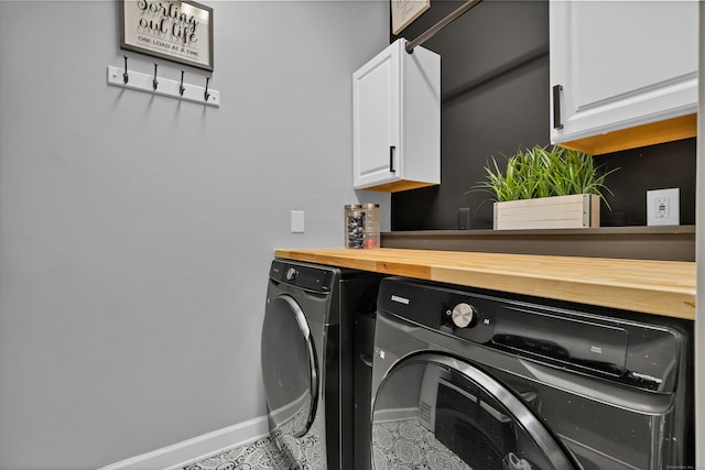 laundry room featuring cabinets and independent washer and dryer