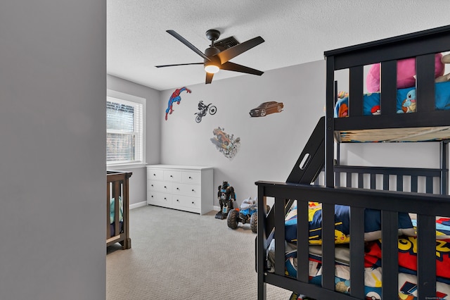 carpeted bedroom with a textured ceiling and ceiling fan