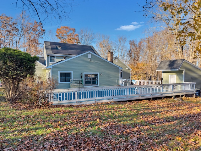 back of property with a wooden deck