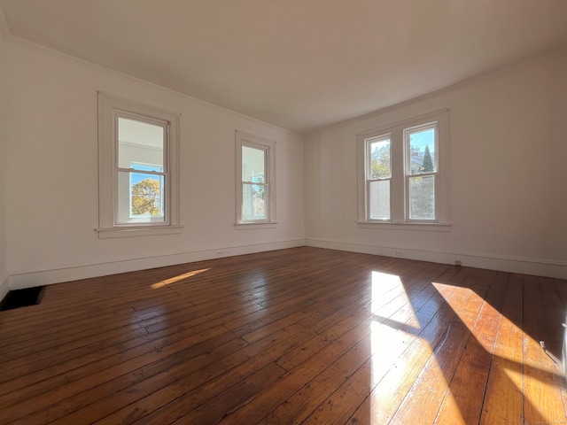 empty room featuring dark hardwood / wood-style flooring