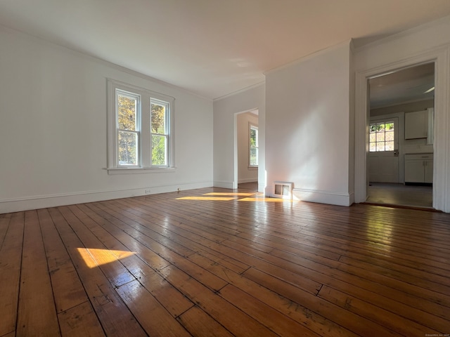 unfurnished room with dark hardwood / wood-style floors and ornamental molding