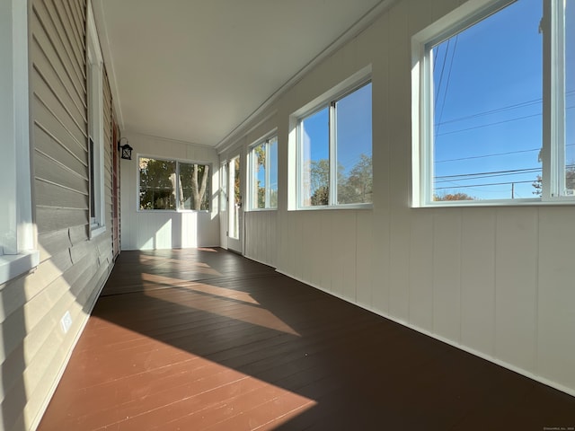 hall with hardwood / wood-style floors and ornamental molding