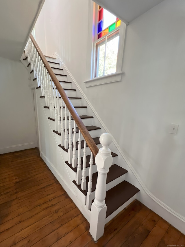 staircase featuring hardwood / wood-style flooring