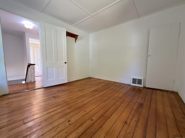 spare room with hardwood / wood-style flooring