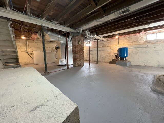 basement with washer / dryer and heating unit