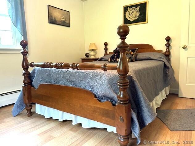 bedroom featuring wood finished floors