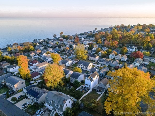 aerial view at dusk with a water view