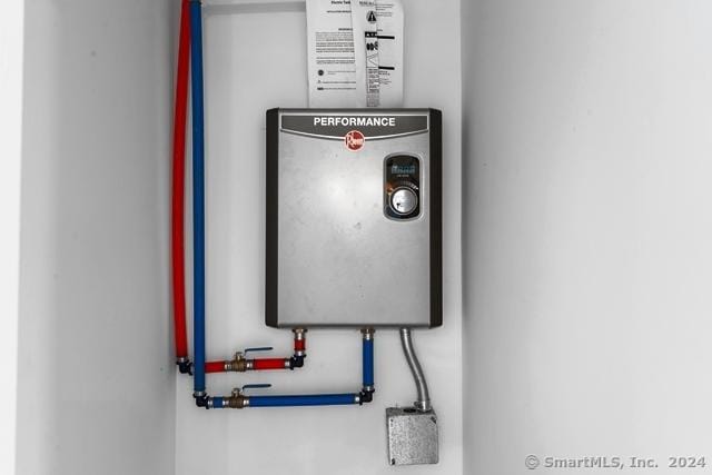 45 Stevens St, Milford, CT 06460 - utility room featuring water heater