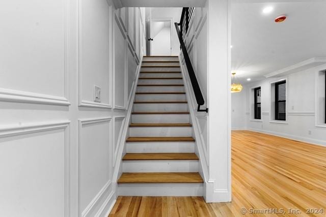 45 Stevens St, Milford, CT 06460 - stairway with a decorative wall and wood finished floors