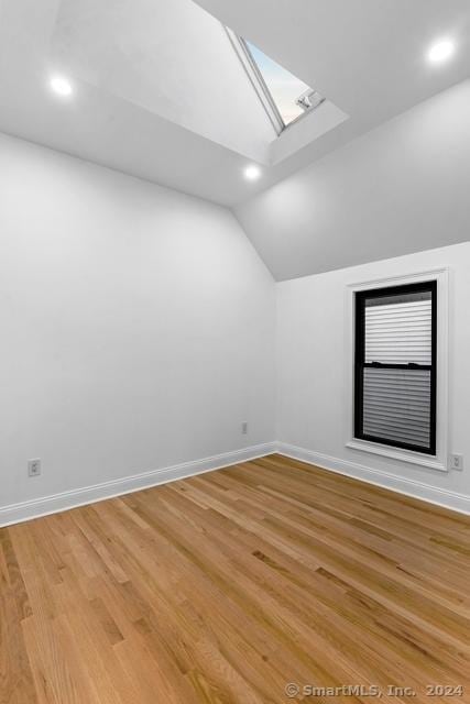 45 Stevens St, Milford, CT 06460 - additional living space with lofted ceiling, baseboards, a skylight, light wood finished floors, and recessed lighting