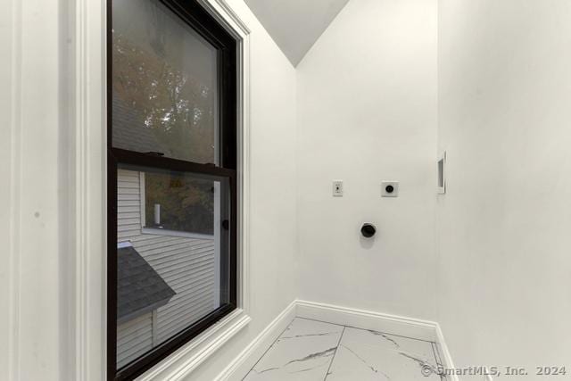 45 Stevens St, Milford, CT 06460 - washroom with electric dryer hookup, baseboards, and marble look tile flooring