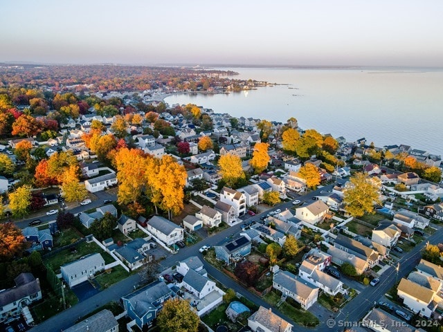 aerial view at dusk with a water view