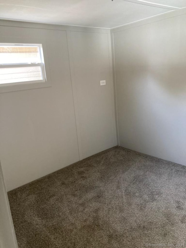 empty room featuring carpet flooring