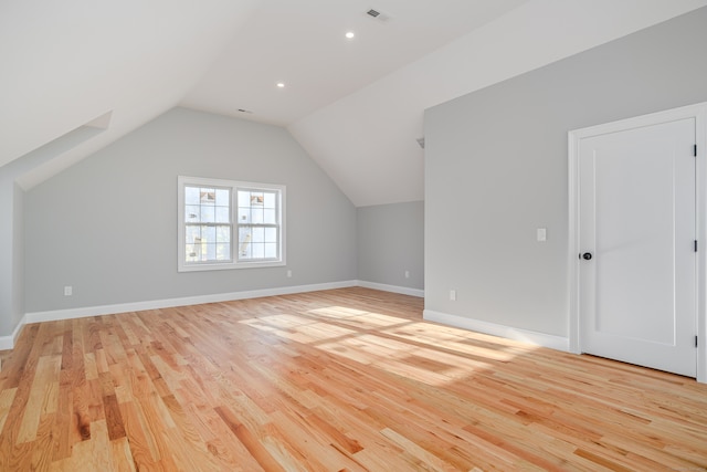 bonus room featuring light hardwood / wood-style floors and lofted ceiling