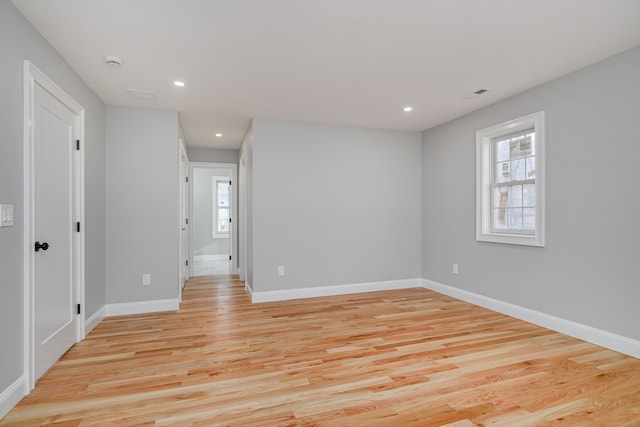 spare room featuring light hardwood / wood-style flooring