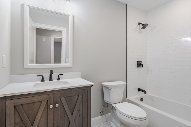 full bathroom featuring vanity, toilet, and tiled shower / bath