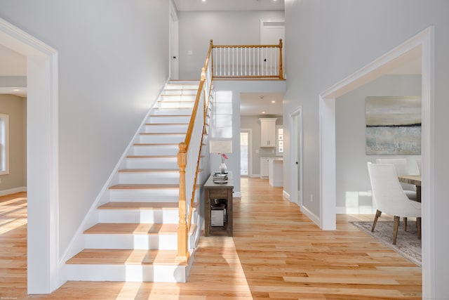 stairs featuring hardwood / wood-style flooring