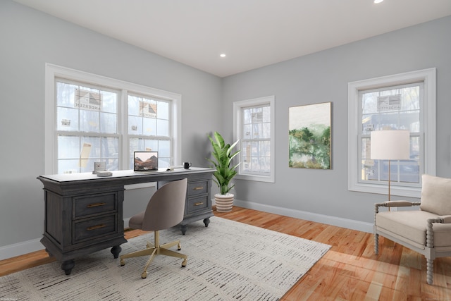 office area featuring a healthy amount of sunlight and light wood-type flooring