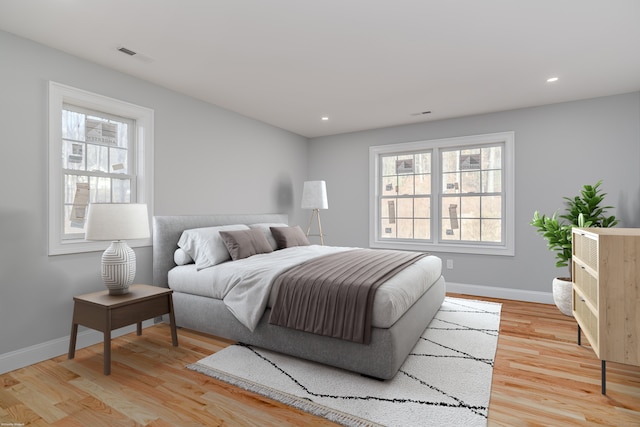 bedroom with light hardwood / wood-style flooring