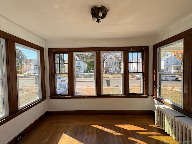 unfurnished sunroom featuring a healthy amount of sunlight