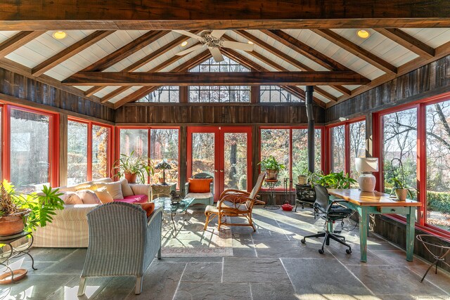 sunroom featuring plenty of natural light, lofted ceiling with beams, ceiling fan, and french doors