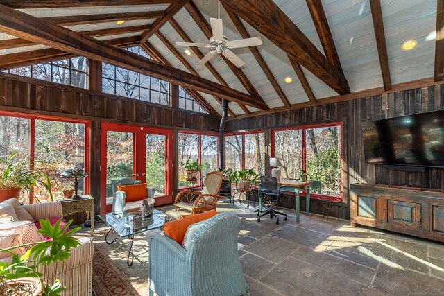 sunroom / solarium featuring ceiling fan and lofted ceiling with beams