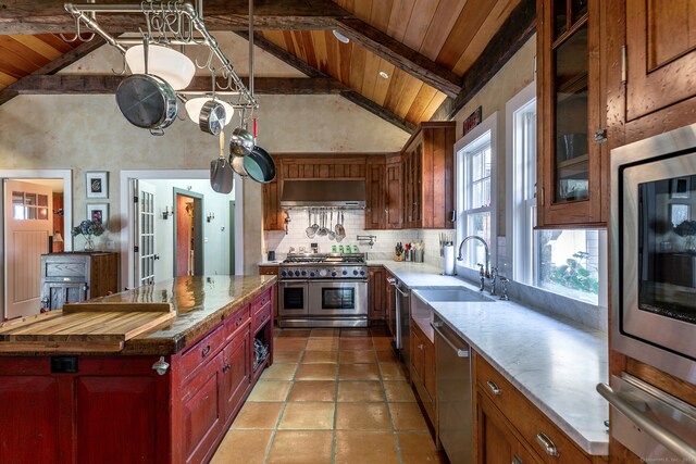 kitchen featuring wood ceiling, stainless steel appliances, high vaulted ceiling, beamed ceiling, and range hood