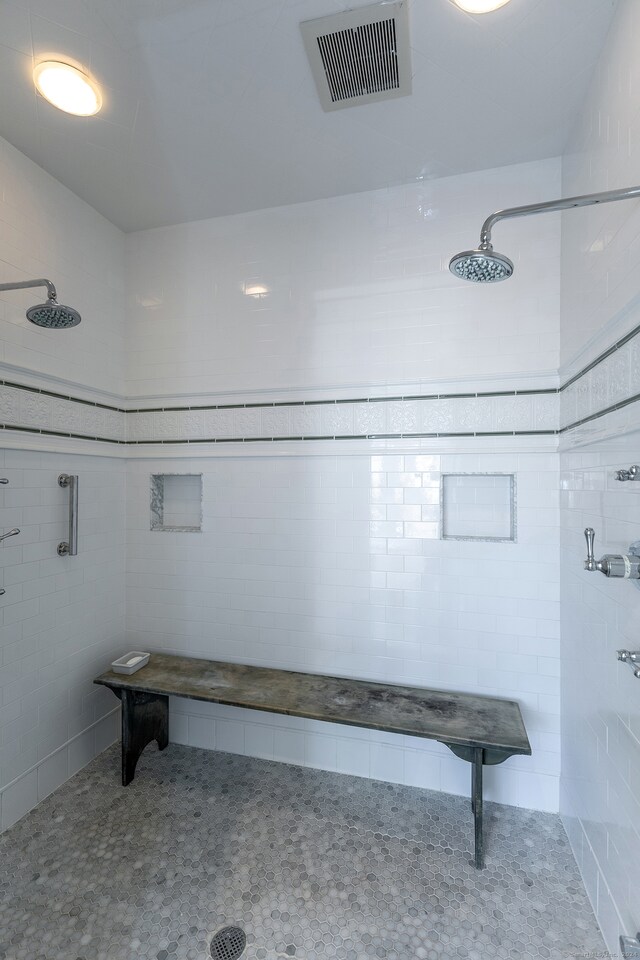 bathroom with tiled shower