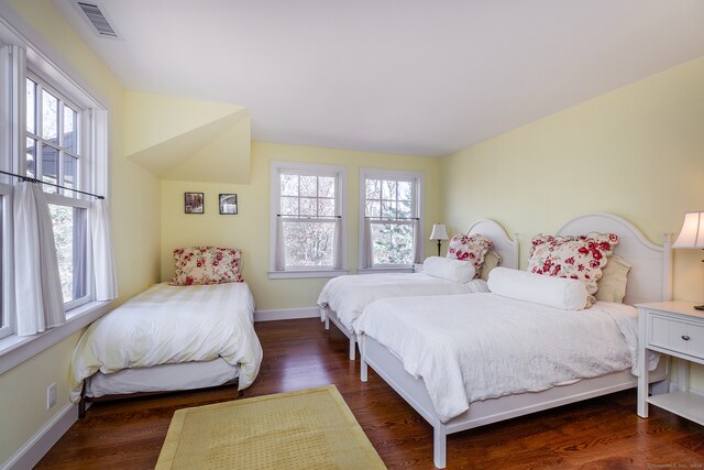 bedroom featuring dark hardwood / wood-style flooring