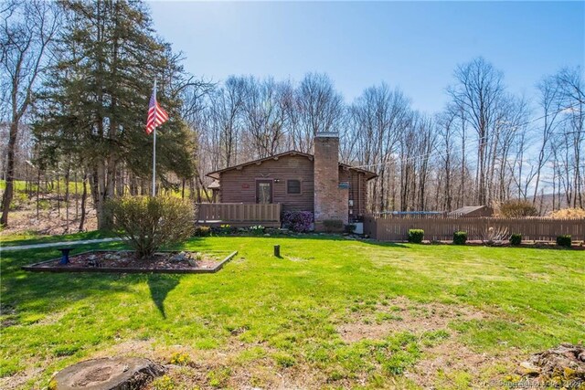 view of yard featuring a wooden deck