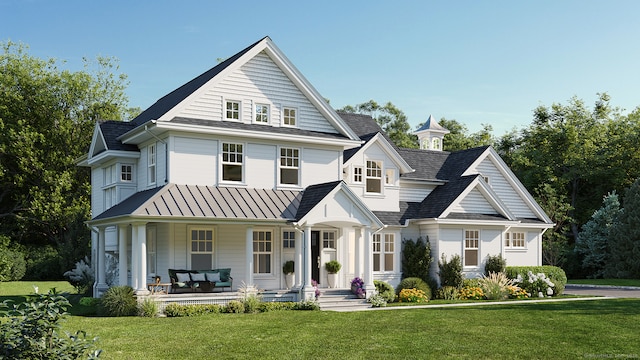 view of front of home featuring a front lawn and covered porch