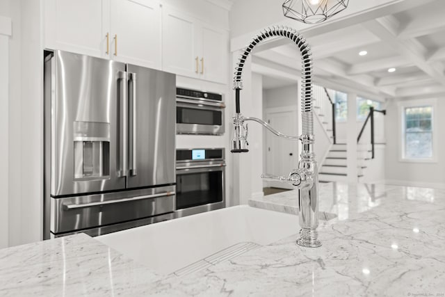 15 Parsons Way, Avon, CT 06001 - kitchen featuring high end refrigerator, white cabinetry, recessed lighting, coffered ceiling, and beam ceiling