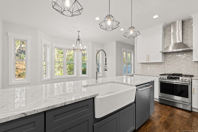 15 Parsons Way, Avon, CT 06001 - kitchen with appliances with stainless steel finishes, wall chimney range hood, gray cabinetry, recessed lighting, and tasteful backsplash