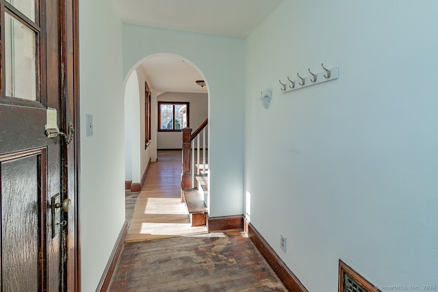 hallway with dark wood-type flooring