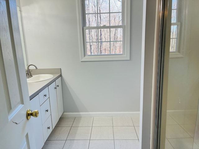 bathroom featuring tile patterned flooring and vanity