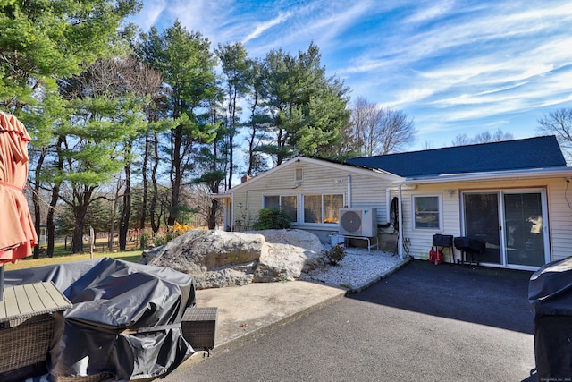 view of patio with ac unit and area for grilling