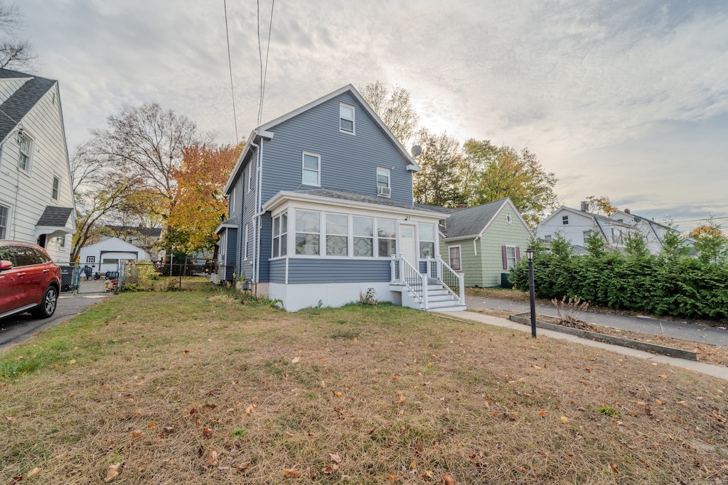 view of front of property with a garage and a front yard